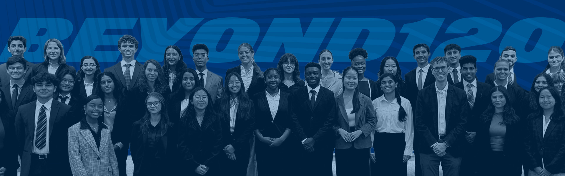 row of professional looking students in blue standing in front of the words, Beyond120