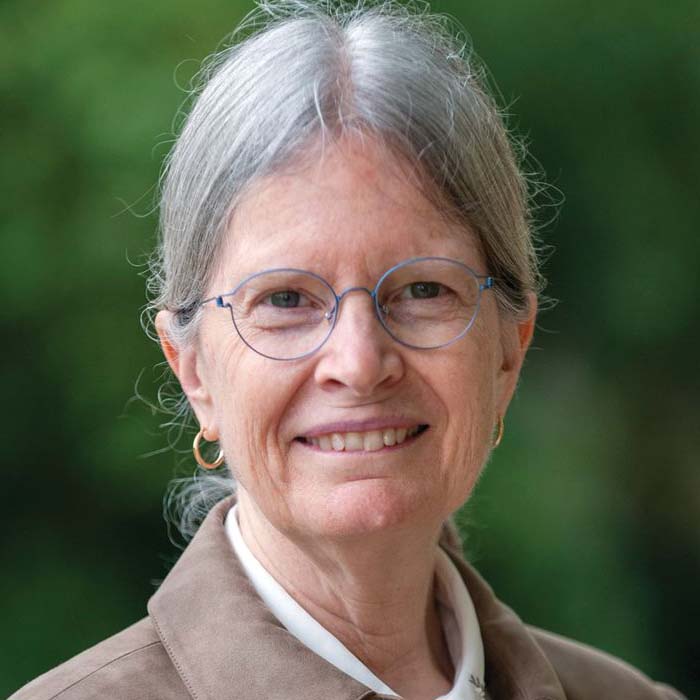 picture of professional woman with gray hair pulled back