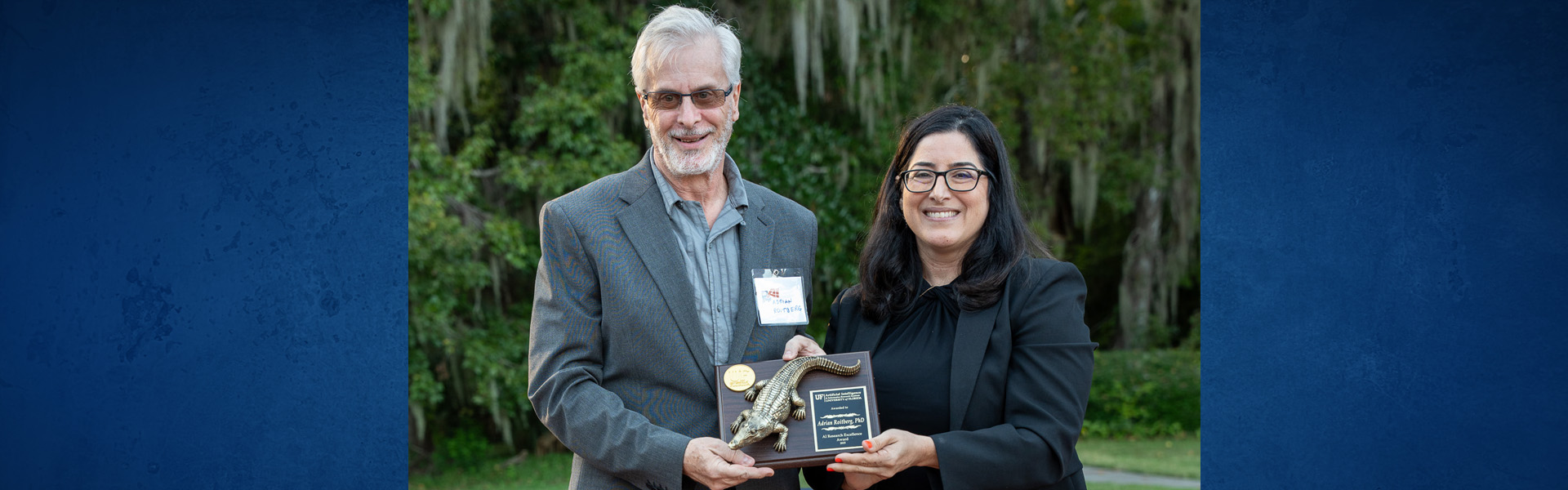 Three black and white portraits on a blue background