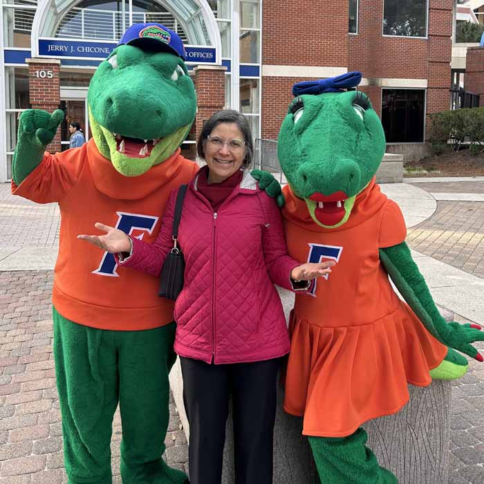 professor with two gator mascots