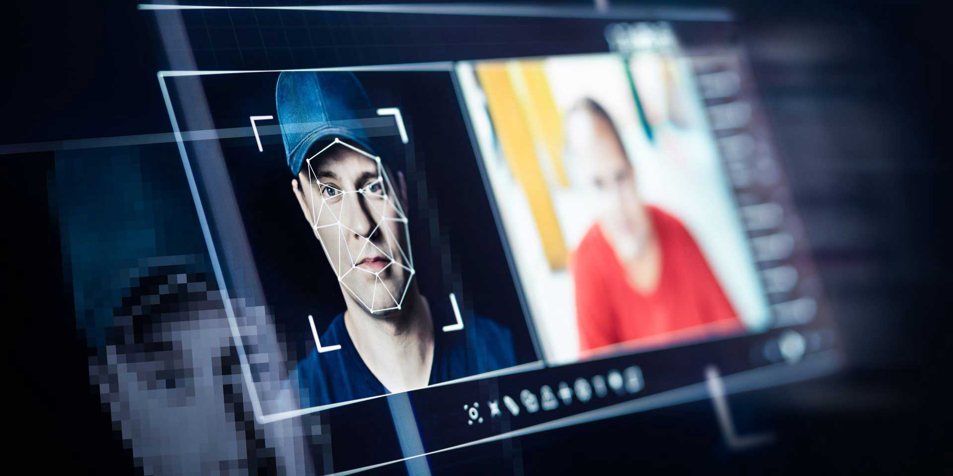 Man's face in facial recognition software on a screen